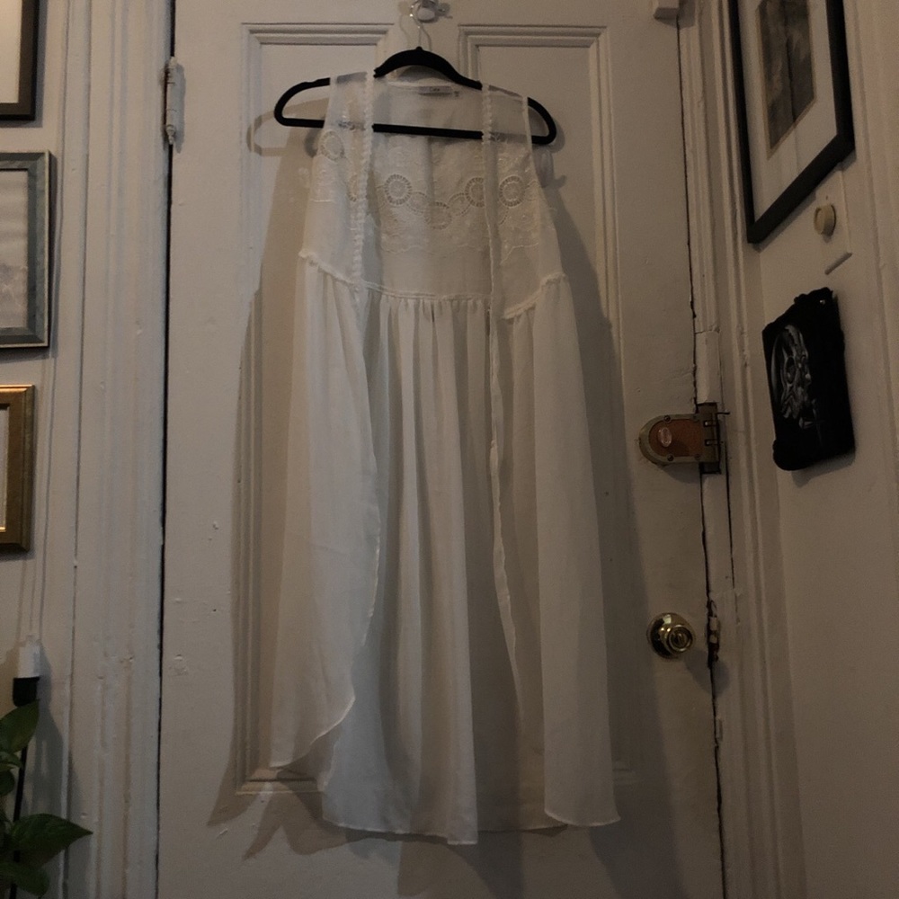 Beautiful white embroidered sheer flowy vest.
